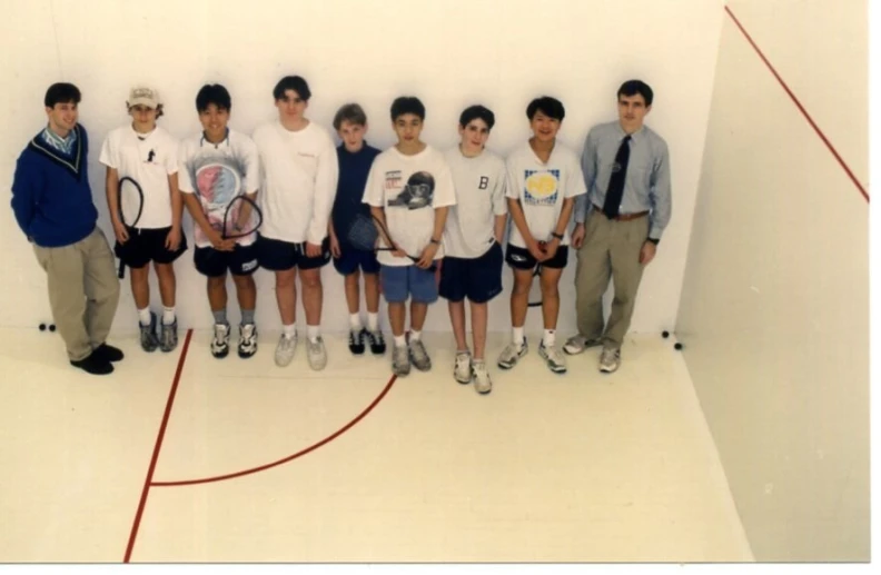 a group of men are posing for a picture