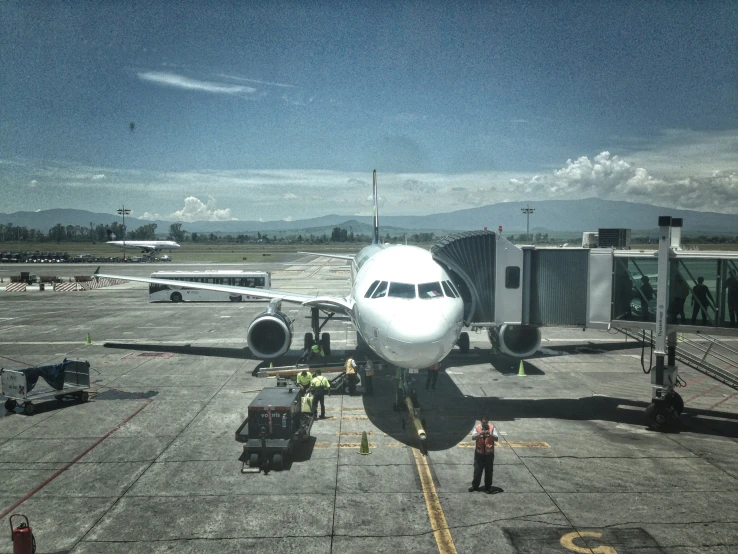 a large jetliner sitting on top of an airport runway