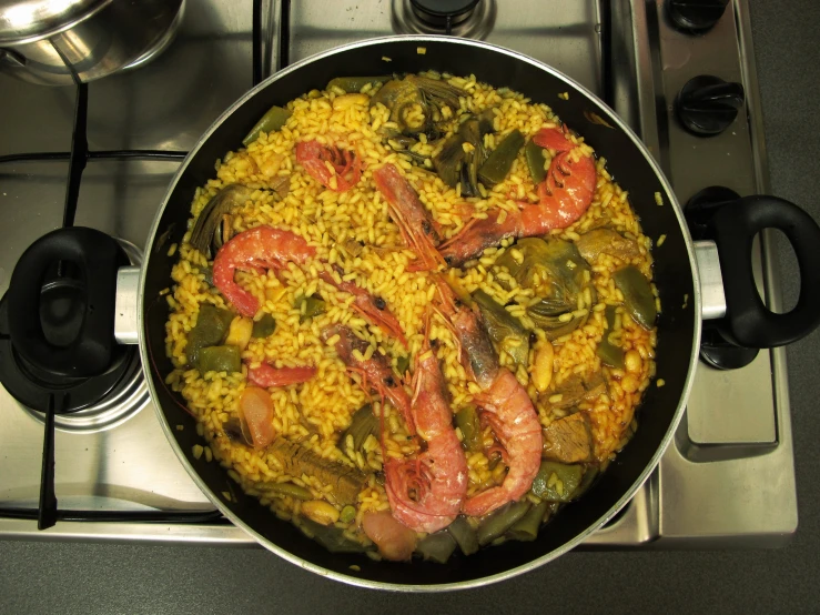 a dish being prepared on top of the stove