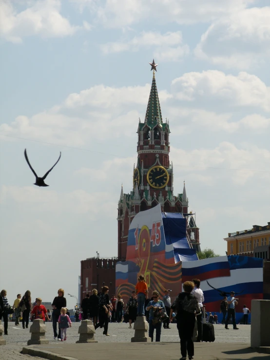 a large tower with a bird flying through it