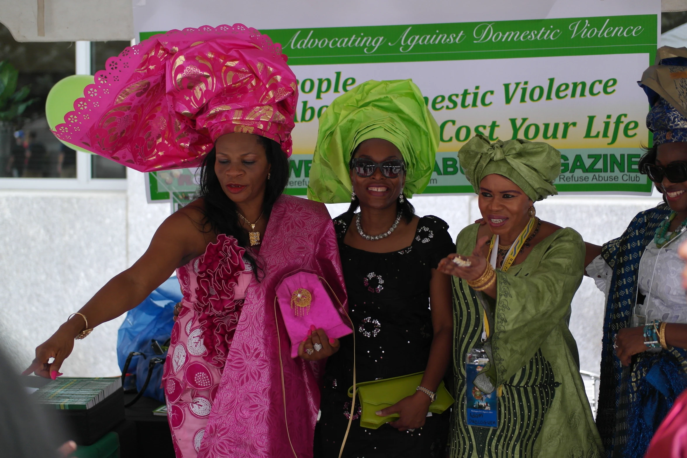 three woman wearing pink and green clothes standing next to each other