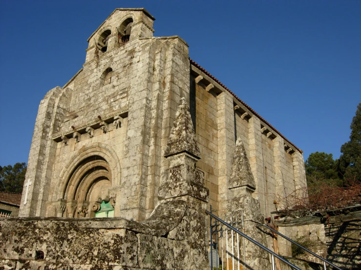 an old church with large stone arches and windows
