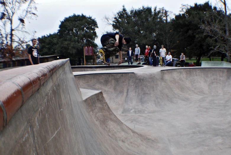 people at the park are skateboarding on ramps