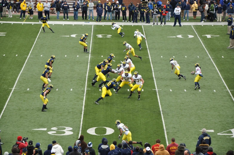 several football players on the field playing a game