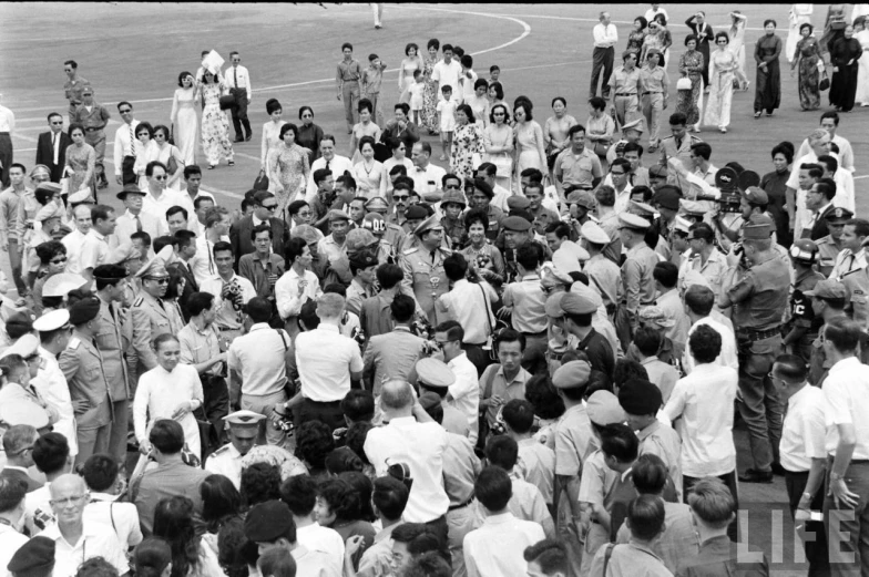 an image of crowd gathered outside in a crowd