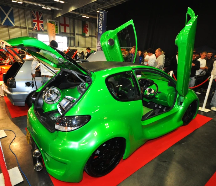 a very shiny green sports car that is on display