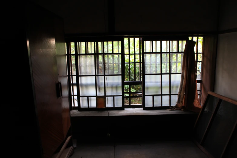 the dark room with open window is empty