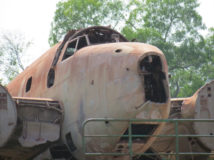 the remains of an old airplane sitting in a junkyard