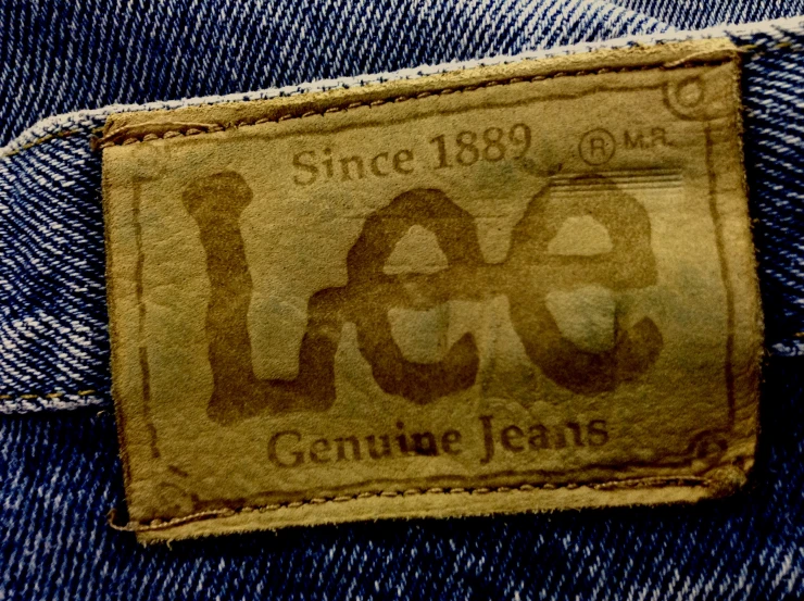a faded label is pictured on a jeans back