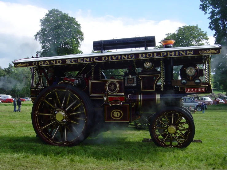 a steam powered truck on display in a park