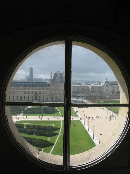 the view from inside a building looking out at a courtyard