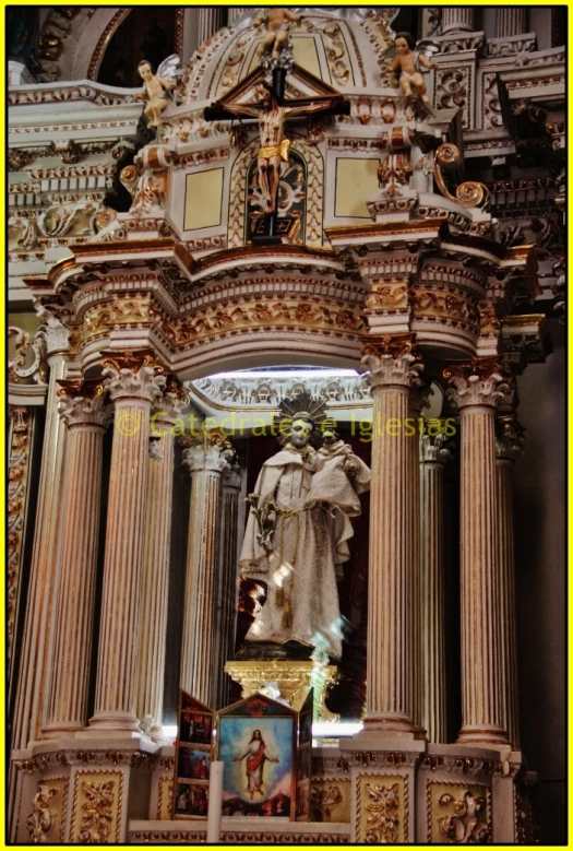 a statue in an ornate alter with columns