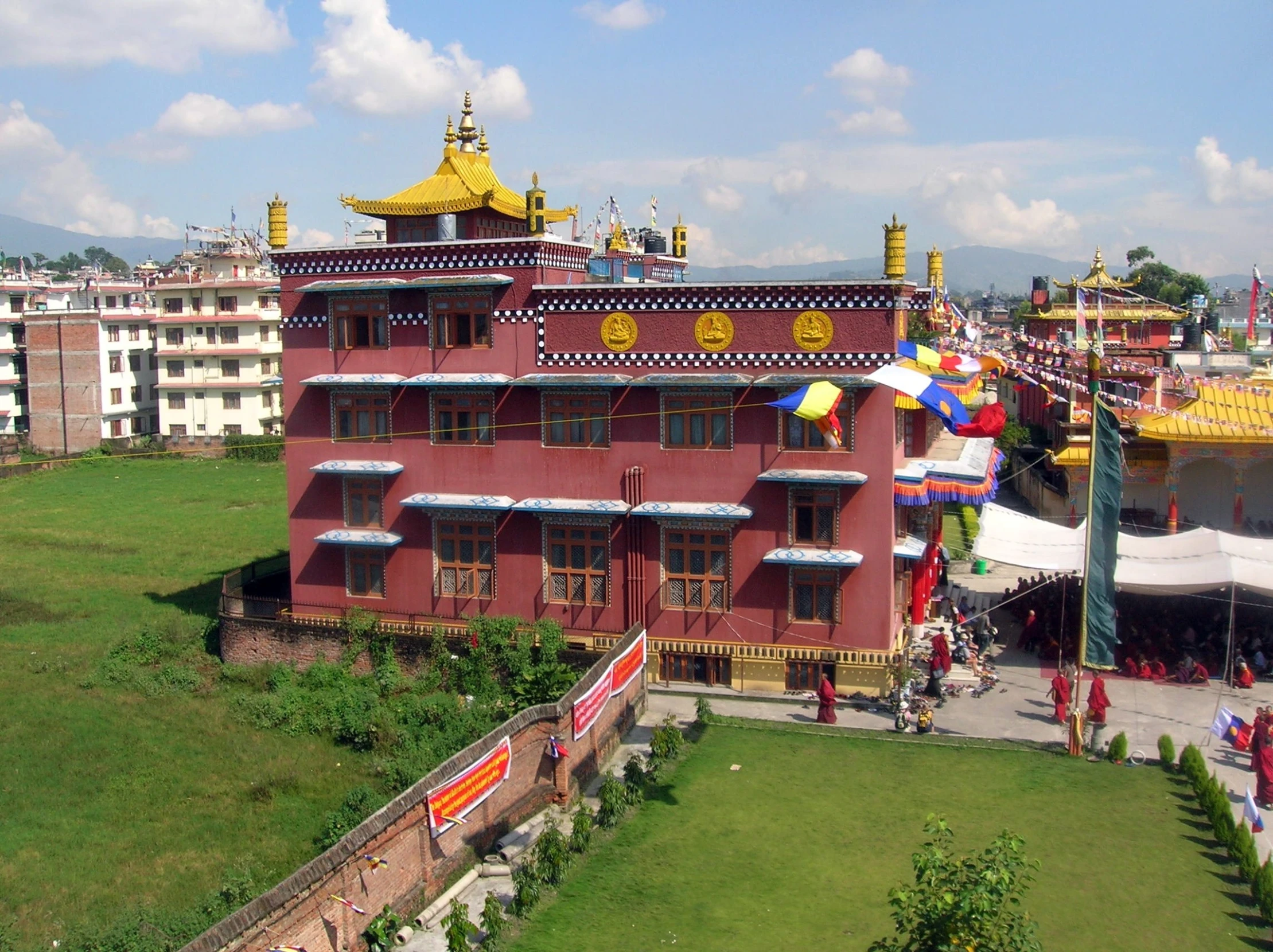 a big colorful building surrounded by lots of green grass