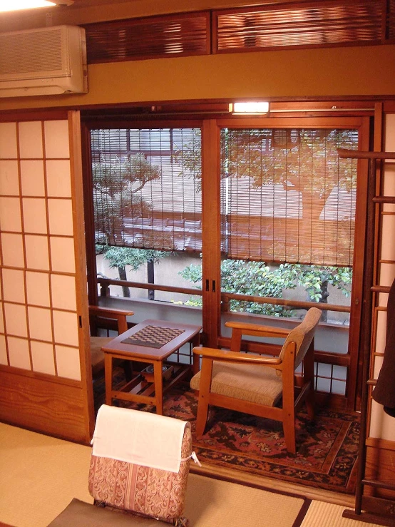 a chair and small table sit in a room