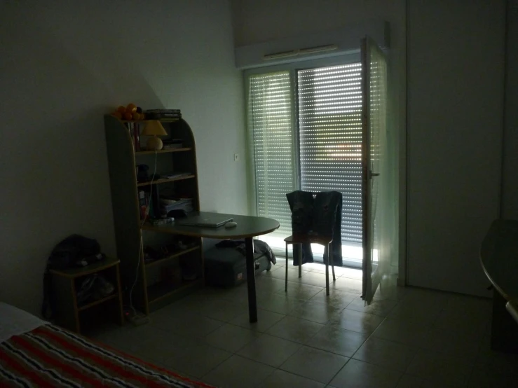 a room with white walls and large windows in it