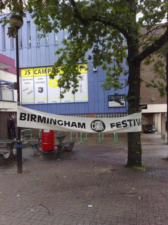 there is a banner in front of a store