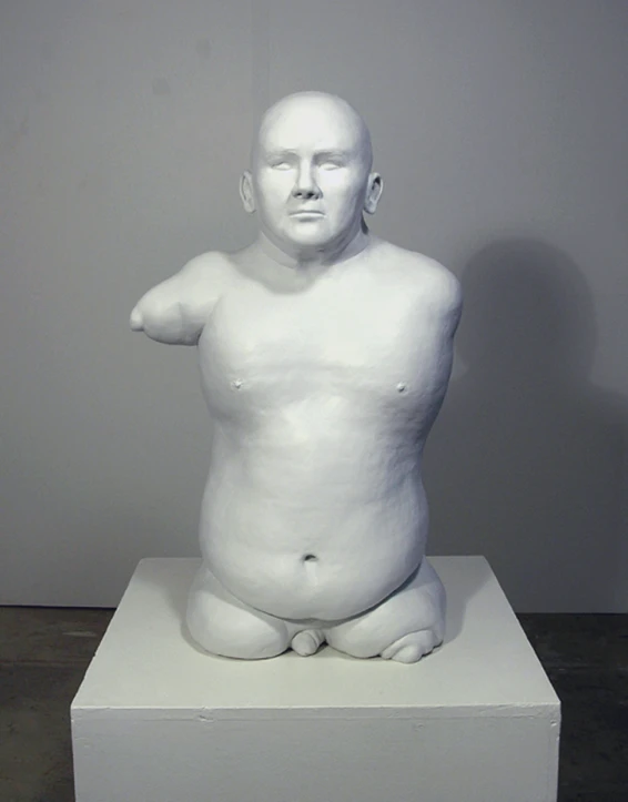 a white statue of a man is on display