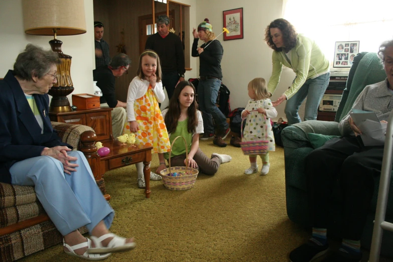 a group of people sitting around a room together