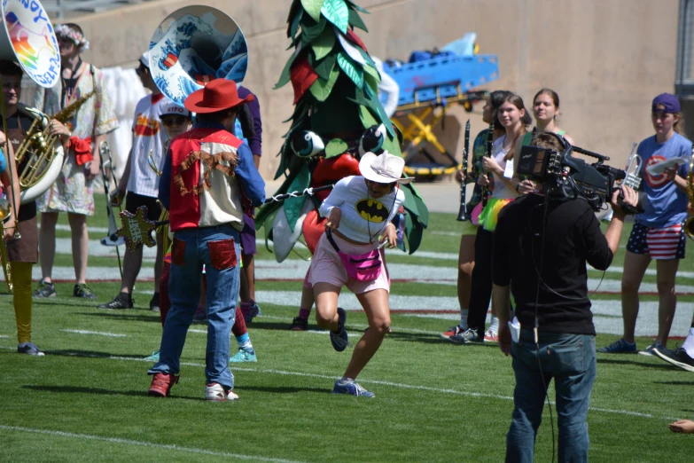 s run through the grass in costumes on the football field