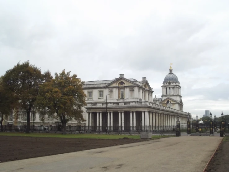 a big white building with two large towers and a clock