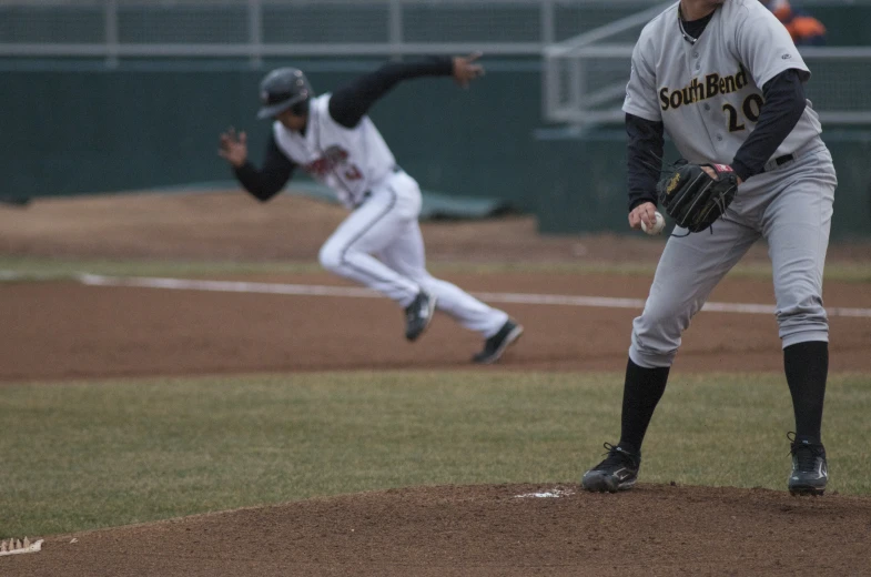 a man that is standing on a baseball field