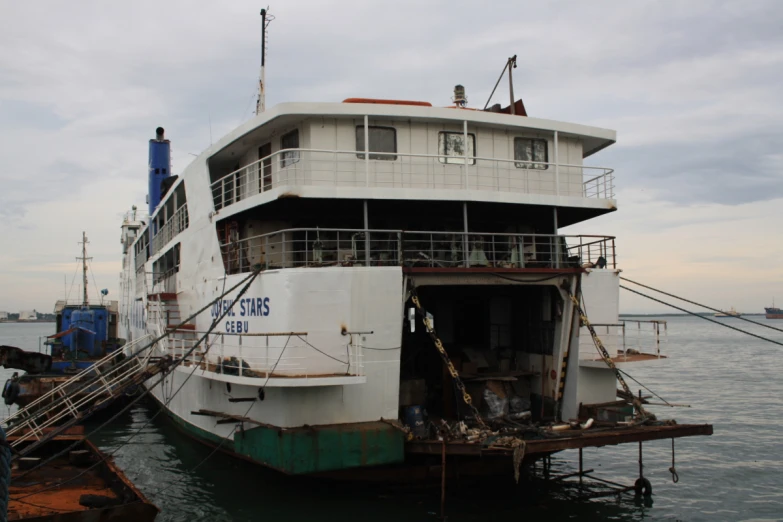 a large boat docked at a large marina