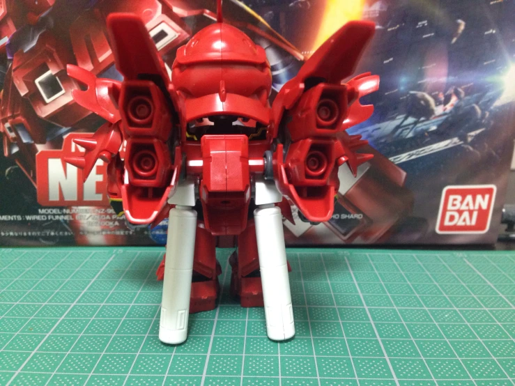 red robot like model with white legs and body with horns