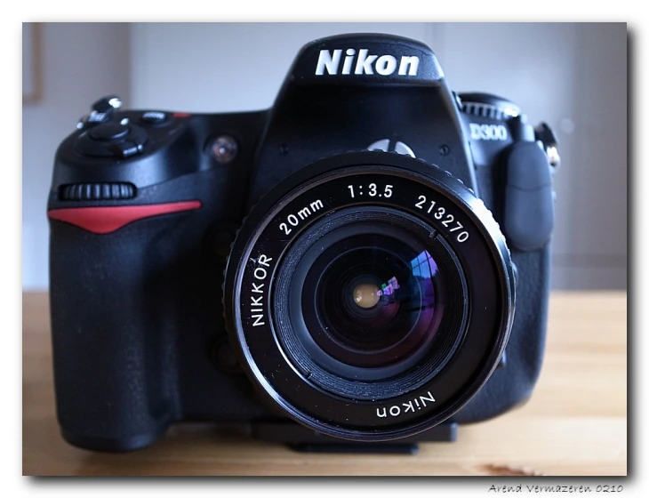 the camera is sitting on a table with its lens