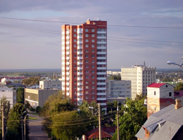 a tall building with a massive, white top