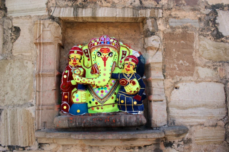 a very big pretty colorful statue on the side of a building