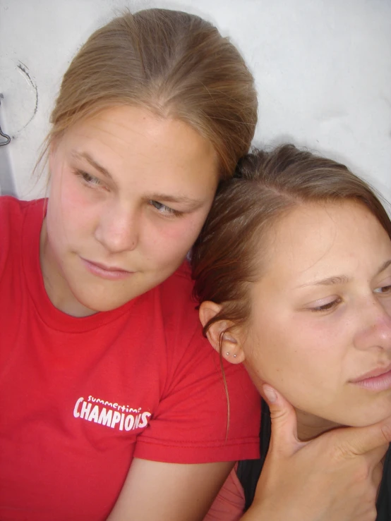 two women pose for a picture near one another