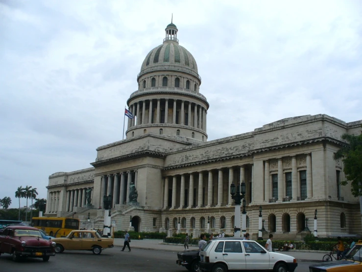 a large government building on the corner of the street