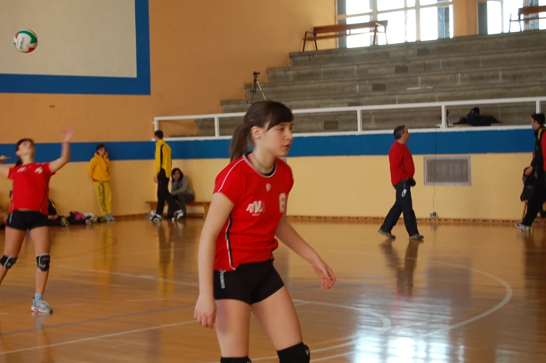 a group of people playing a game of basketball