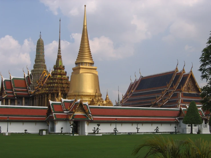 a large building is in the middle of a grassy area