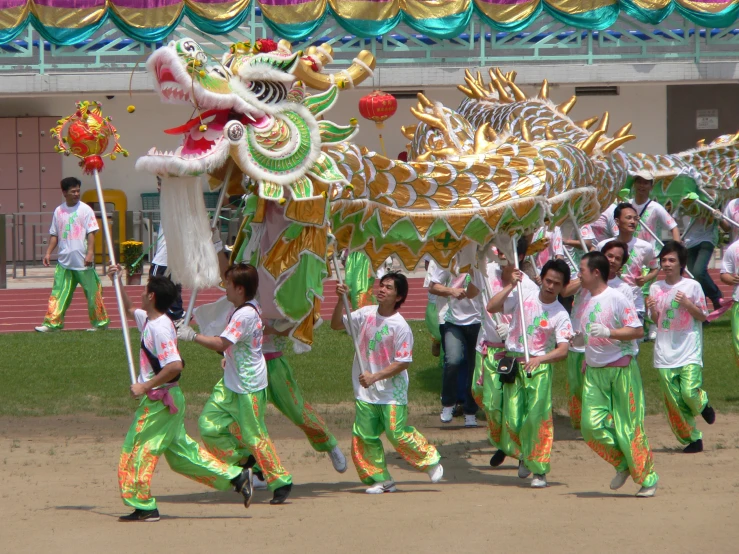 a dragon and some people marching in green