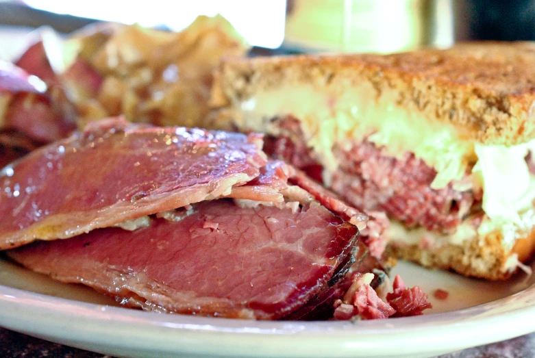 a large plate of food containing a sandwich and chips