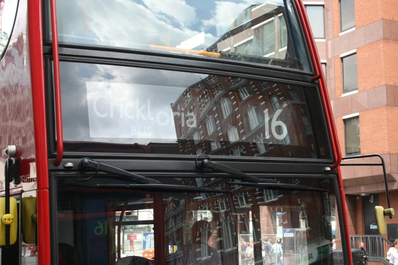 a close up of the outside of a double decker bus