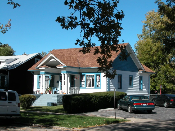 a couple of houses with a truck parked in front