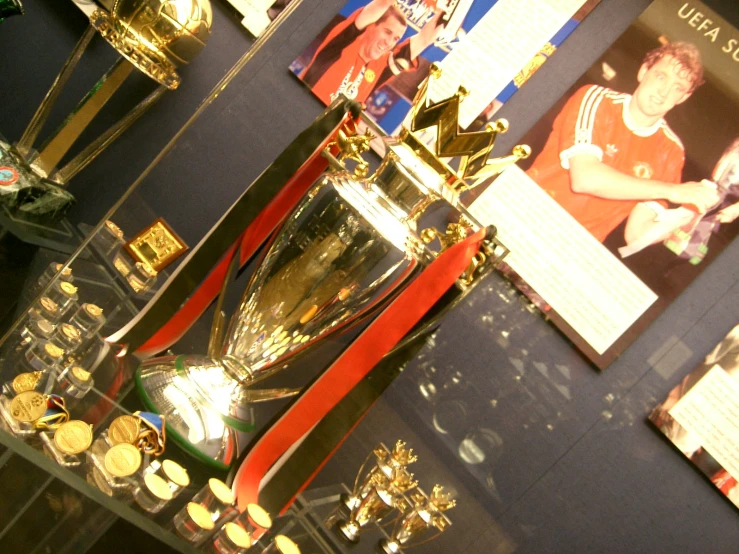 the trophy stands beside all the other trophies