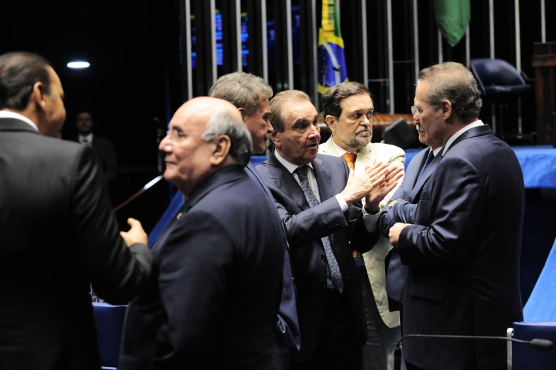 a group of men standing next to each other on a stage