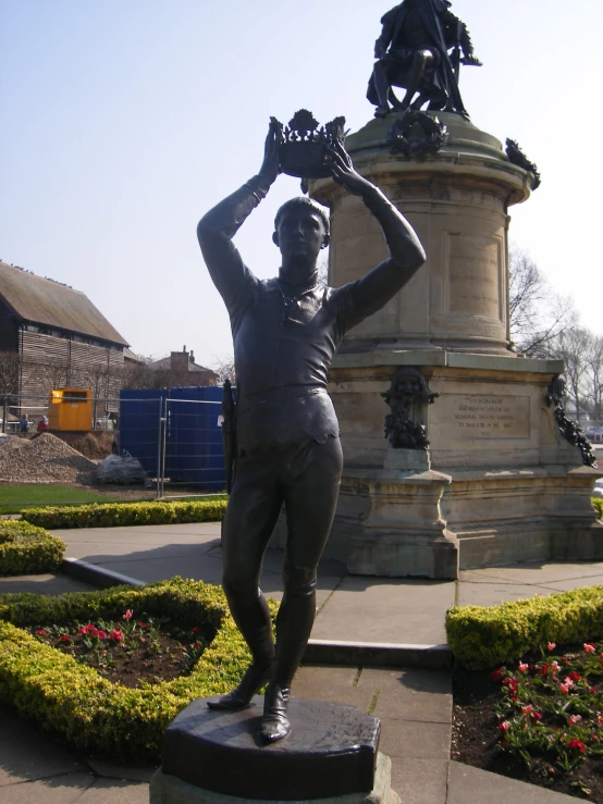 a statue in the middle of an outdoor park