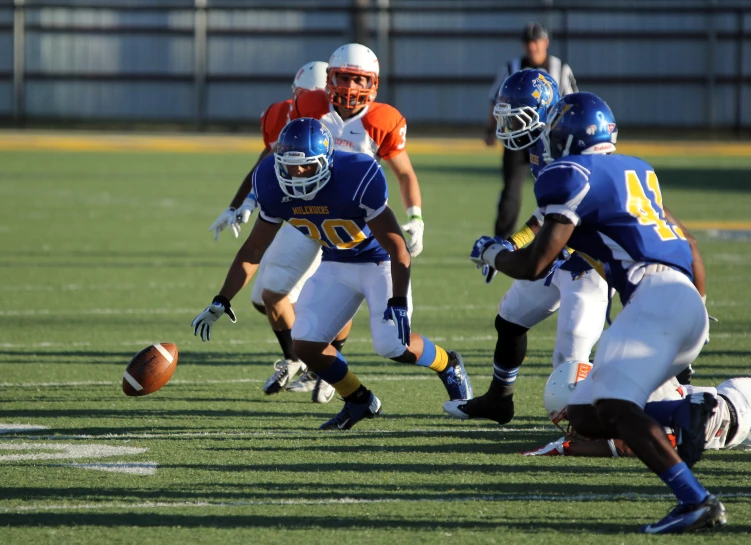 a group of young men playing a game of football