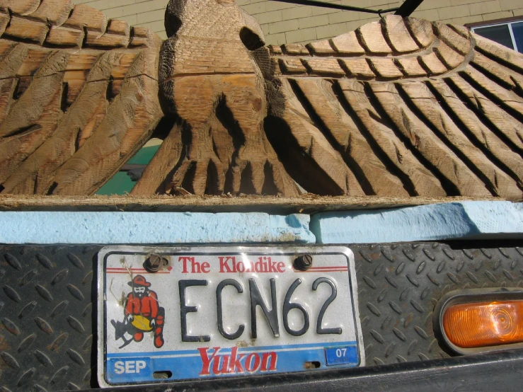 a license plate is displayed in the back of a car