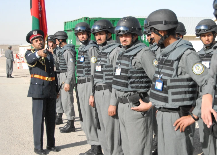 a group of men in uniform standing near each other