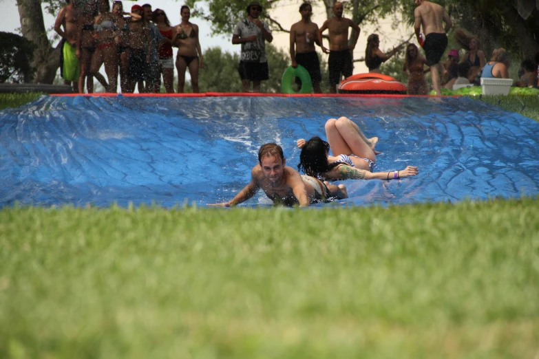 some people are playing in the water at a park