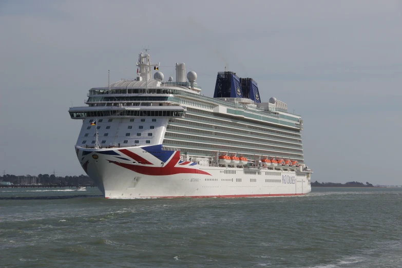 the large cruise ship has red, white and blue paint