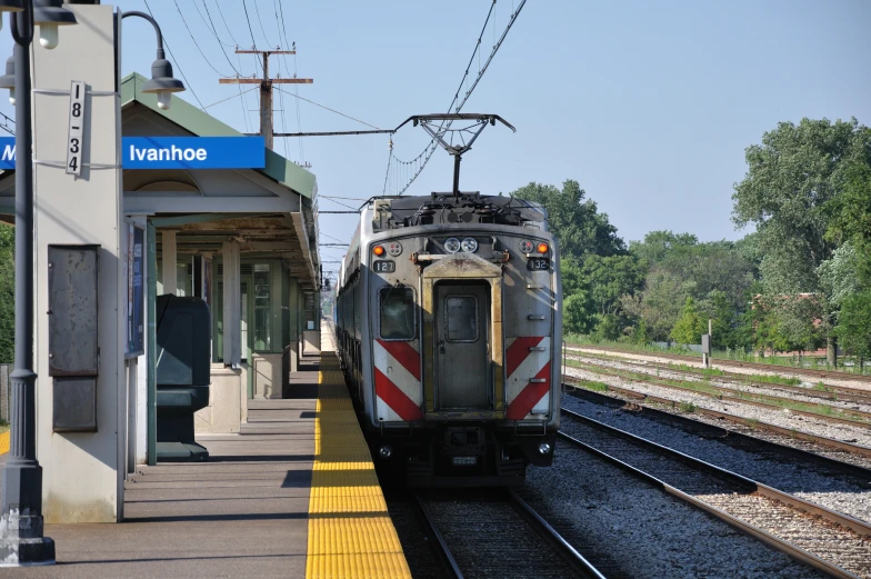 a passenger train pulling into a train station