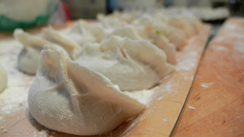 several pieces of dumplings with sugar sprinkled in them