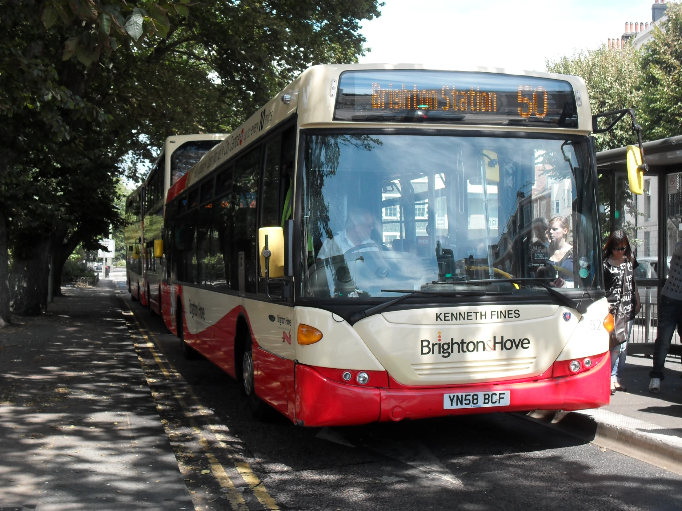 a city bus driving down the street