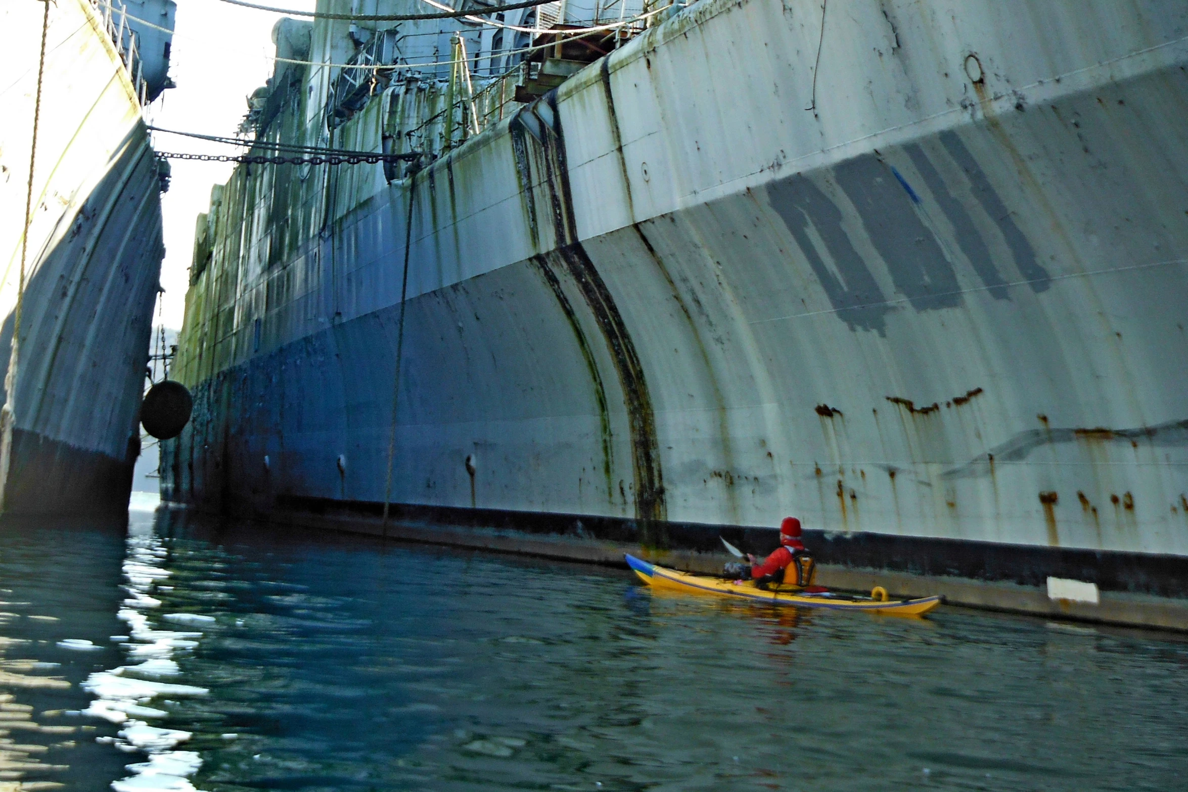 a person on a small boat in the water